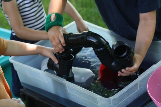 preschool water play and science activity - pvc pipes, funnels and water