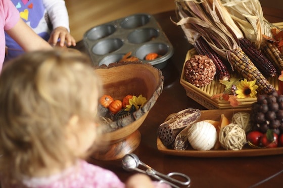 toddlers and preschoolers around a Fall Sensory Table