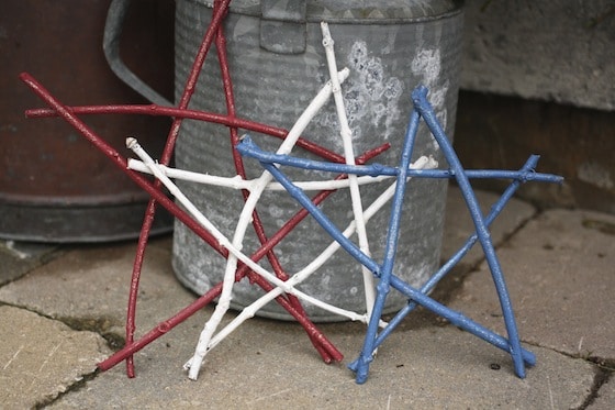 red white and blue stars against a rustic watering can