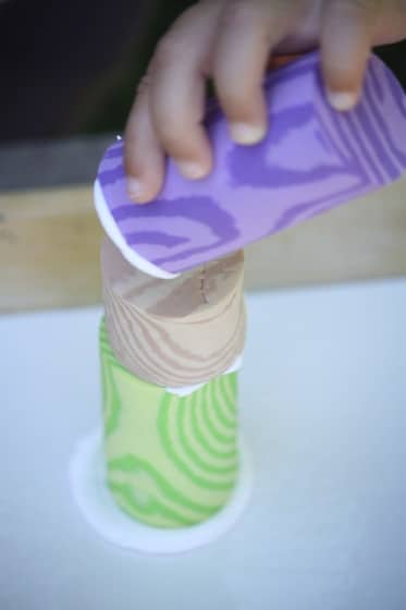 toddler stacking blocks spread with shaving cream