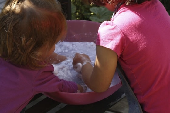 cleaning up in a large bowl of water