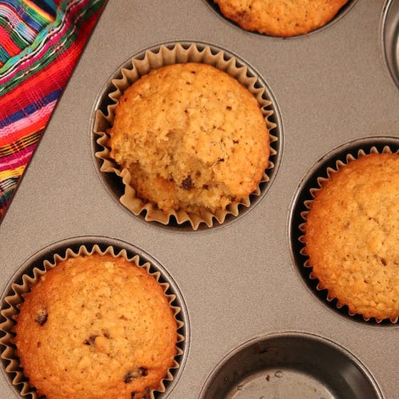 top view of  baked orange oatmeal orange raisin muffins in tin