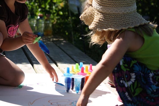 kids painting with homemade coloured ice pops