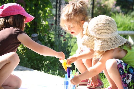 Children choosing their coloured frozen paint pops 