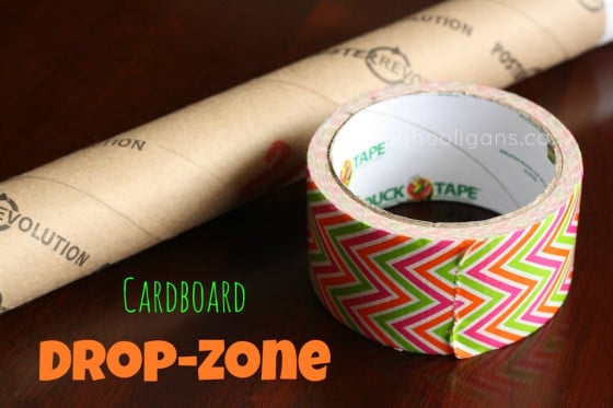 cardboard drop zone - a tube and a roll of duck tape