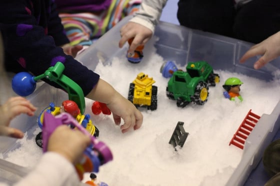 vehicles in a snow sensory bin