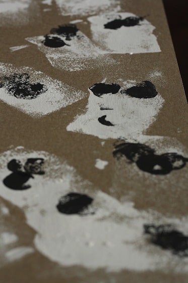 ghosts stamped on cardboard with sponge dipped in white paint