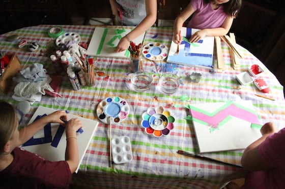 Kids making tape resist art