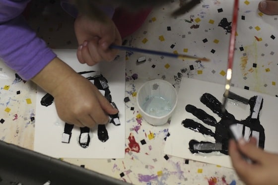 gluing styrofoam "bones" onto hands for an x-ray craft