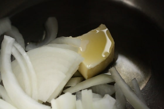 cooking onions, butter and salt for tomato soup