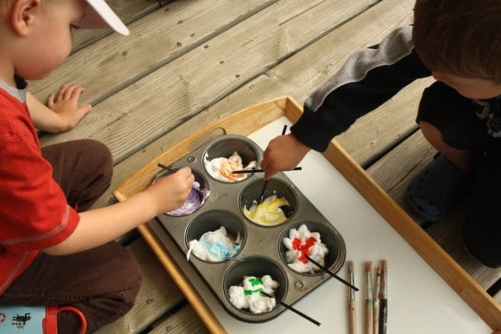 preschoolers colouring shaving cream with food colour