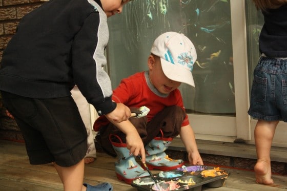 dipping paintbrushes in coloured shaving cream