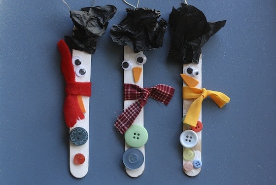 3 craft stick snowman ornaments with tissue paper hats