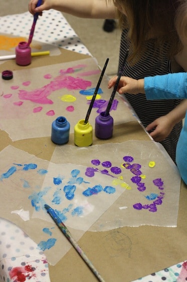 toddlers and preschoolers painting wax paper