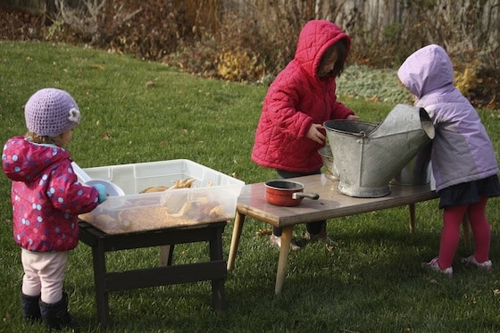 playing with corn and chestnuts in the outdoor kitchen