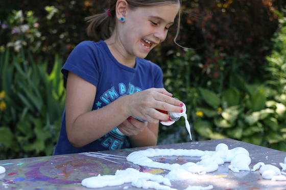 kids cleaning art table