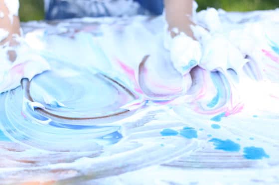 kids playing with shaving cream and food colouring