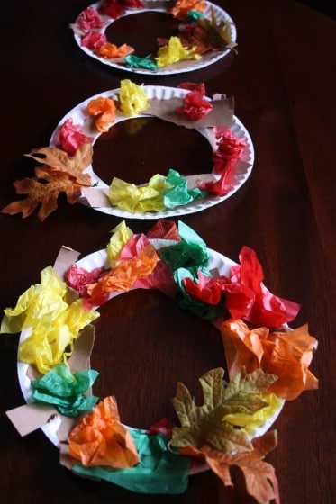 3 fall wreaths made by toddlers and preschoolers with tissue paper and paper plates