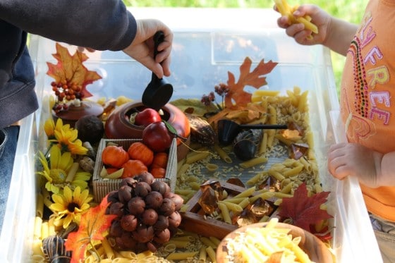 preschool boys shopping pasta in fall sensory bin 