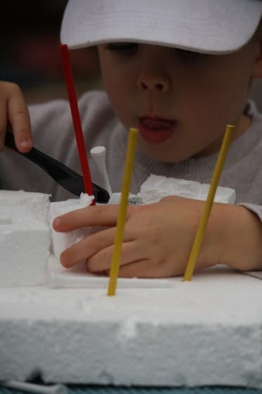 toddler building with homemade styrofoam construction set