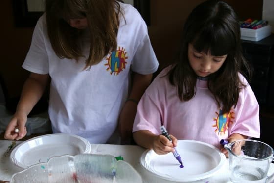 kids doing dry erase and water experiment