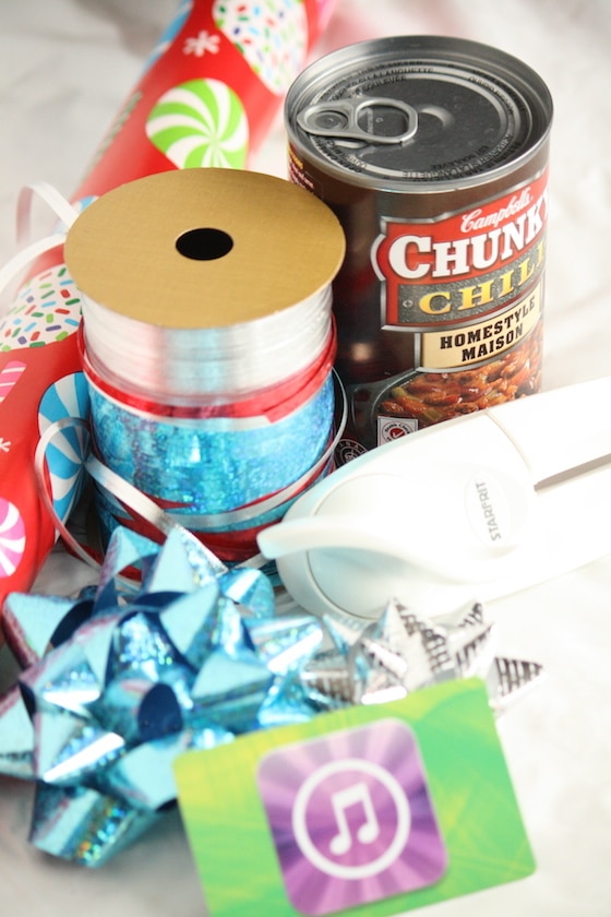 tin can with pull tab top, wrapping paper and ribbon