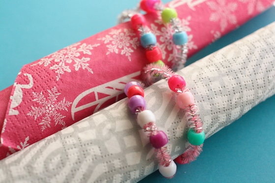 2 paper napkins in beaded pipe cleaner napkin rings