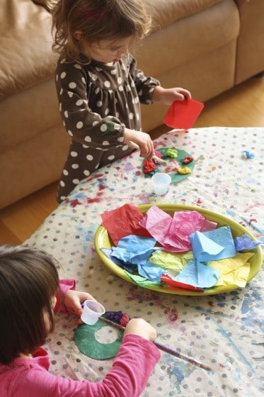 kids making tissue paper wreath ornaments