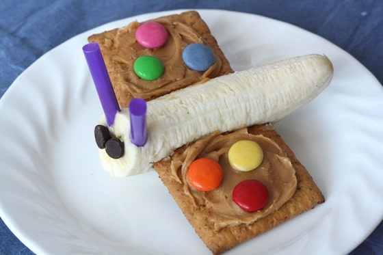 Butterfly snack made with banana for body and  graham crackers, peanut butter and smartie for wings