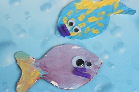 purple fish with purple straw mouth, blue and yellow fish with purple mouth