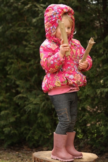 toddler tapping 2 sticks together