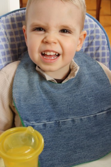 child wearing homemade denim bib