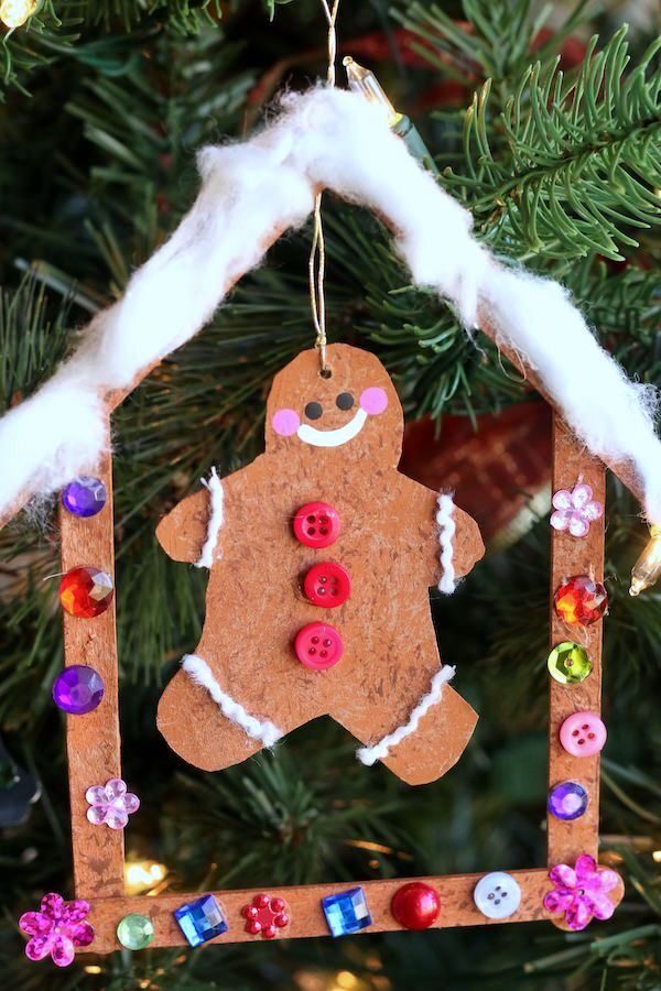 cardboard gingerbread man in craft stick gingerbread house ornament