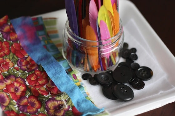 sensory materials as supplies for snowman art project