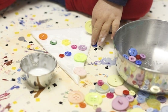 gluing buttons on styrofoam tree ornaments