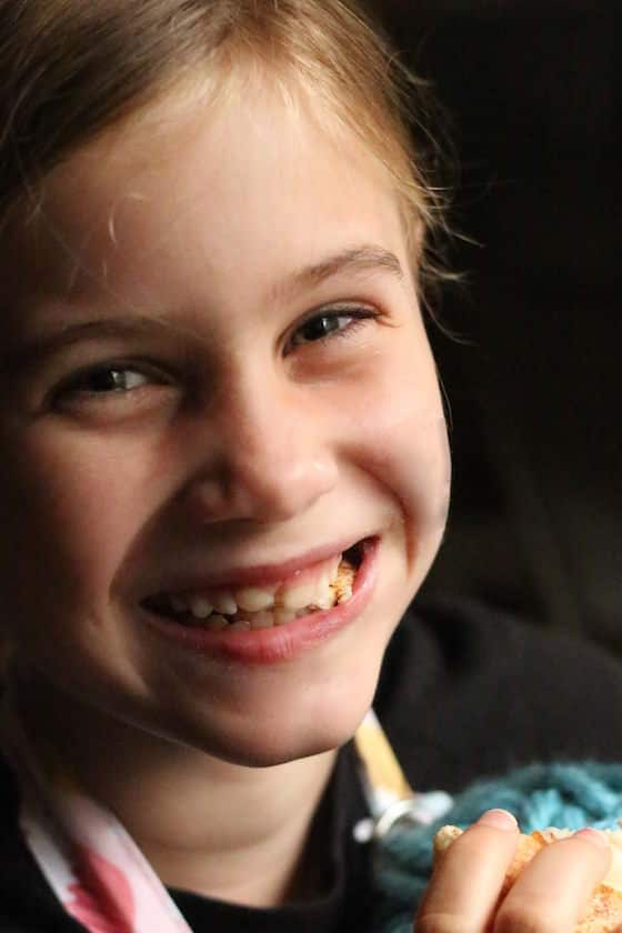 child eating homemade bread machine cinnamon roll