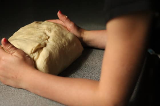 forming an oval with the dough