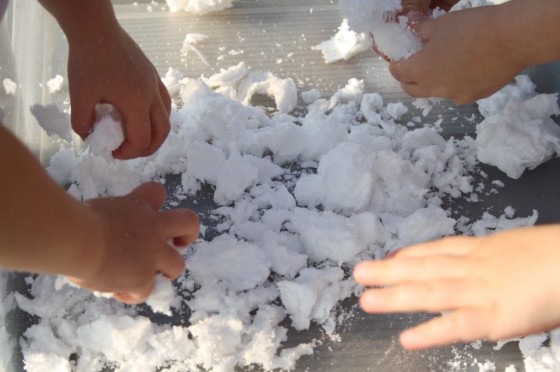 kids hands playing with ghost mud