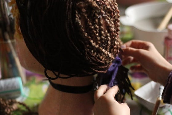 child making pony tail on styrofoam self portrait