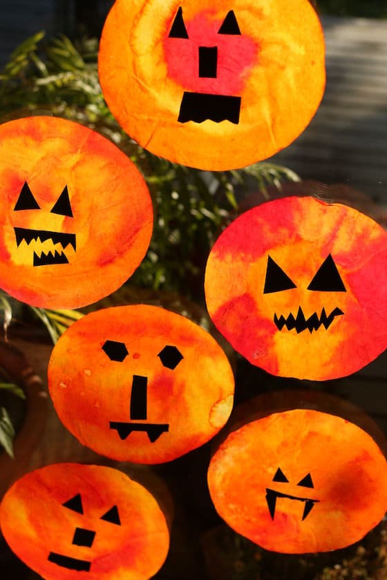 Pumpkin Sun Catchers made with coffee filters and liquid watercolours