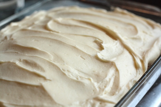 overview frosted carrot cake in 9x13 pyrex baking dish