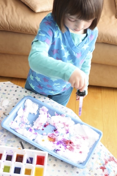 using a medicine dropper and liquid watercolours to colour the snow 