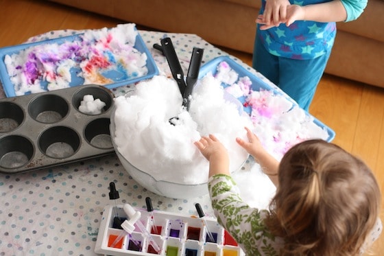 large bowl of snow and tray of liquid watercolours