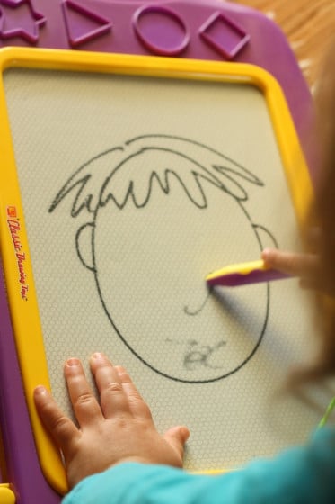 preschooler drawing activity - faces on the magna doodle