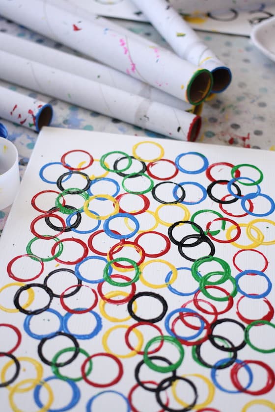 red, yellow, blue, green, black circles stamped by preschooler