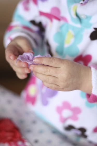 crumpling the tissue paper for a heart shaped Valentine wreath