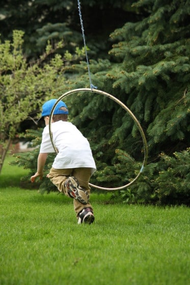 climbing through a hula hoop - gross motor development