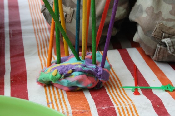 craft sticks stuck in ball of play dough