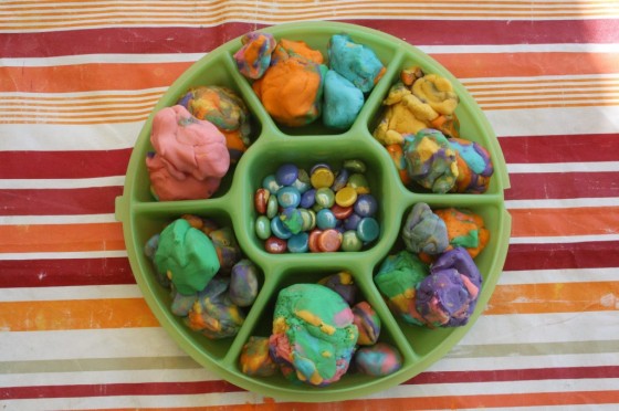 tray of play dough and beads