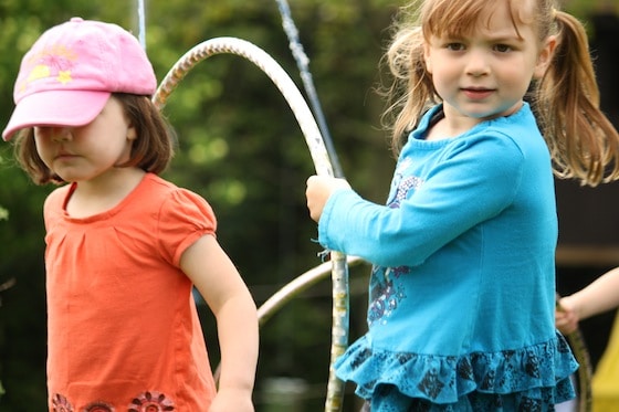 pulling hula hoops along the clothes line